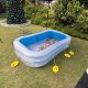Fishing Pond game, set up at an event in Singapore with xxx — colorful toy fish floating in a pond, ready for kids to catch with small fishing rods.