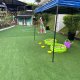 Two green circular fishing ponds with colorful fish inside, ready for kids to catch and enjoy at Chatsworth International School, Singapore.