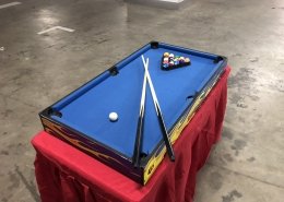 Mini 7 Ball Pool table set up at an event in Singapore, offering a fun and compact version of classic pool for casual play.