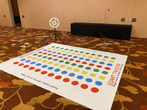 A spacious Twister mat with vibrant colors spread across the floor, ready for rent in Singapore.
