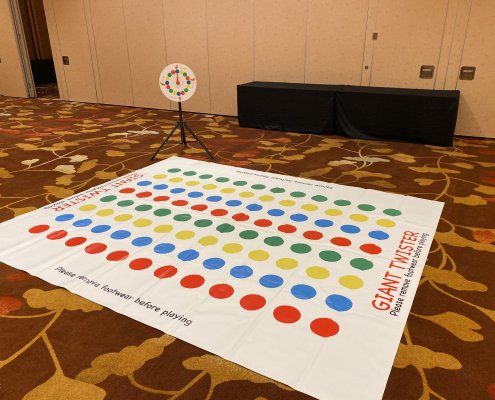 A spacious Twister mat with vibrant colors spread across the floor, ready for rent in Singapore.