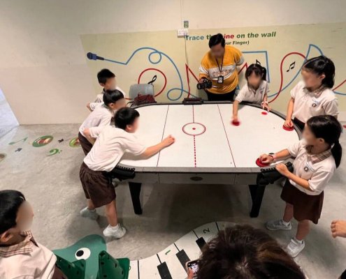Multiplayer Air Hockey - Henry Park Primary School Participants competing on the multiplayer Air Hockey table at Henry Park Primary School, Singapore. Ideal for team-based arcade challenges.