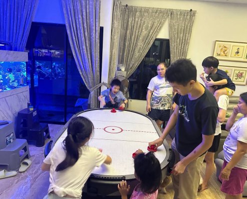 Multiplayer Air Hockey - Willkison Road Guests enjoy the 4–6 player Air Hockey table in Singapore event, a crowd-favorite for interactive group gameplay.