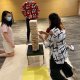 Participants challenging each other in a Giant Jenga game in Singapore, testing their steady hands and nerves.