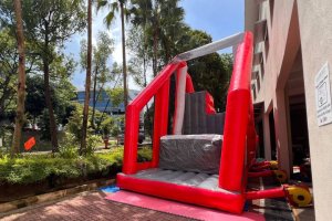 The Inflatable Free Fall platform with a cushioned landing area.