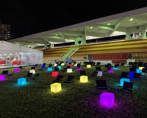 Kermit folding beach chairs and lighted led cubes event furniture set up for an outdoor movie night in Singapore