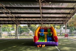Inflatable basketball game at Kick Off, Singapore with colorful hoops, great for all-age events.