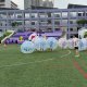 Group of players inside inflatable bubbles playing soccer at Northlight Sports Fiesta 2024, Singapore