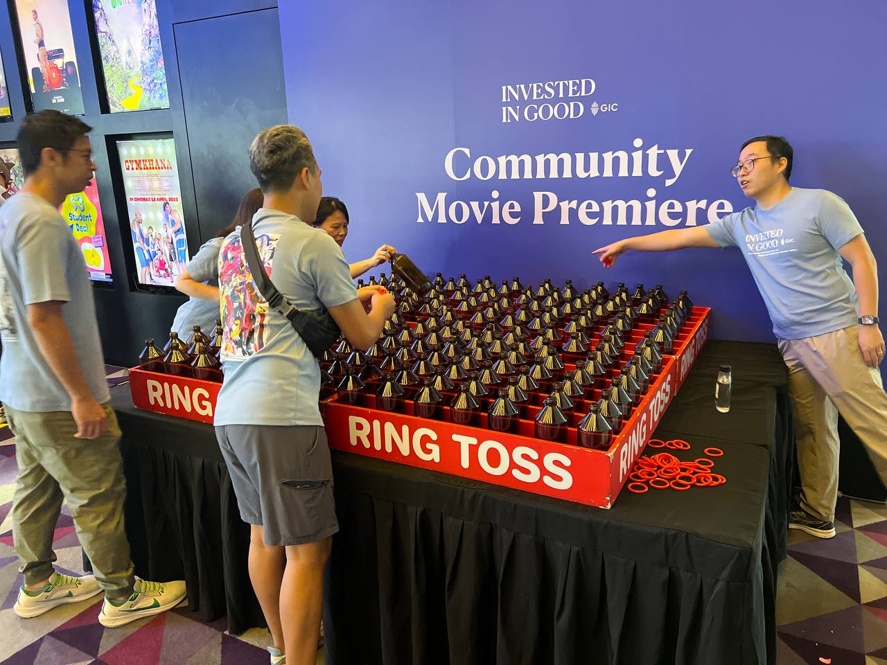 Ring toss setup with bottles placed in rows at Clementi Avenue, Singapore.