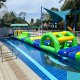 Bridge section of a water inflatable course featuring a curved structure with open spaces underneath