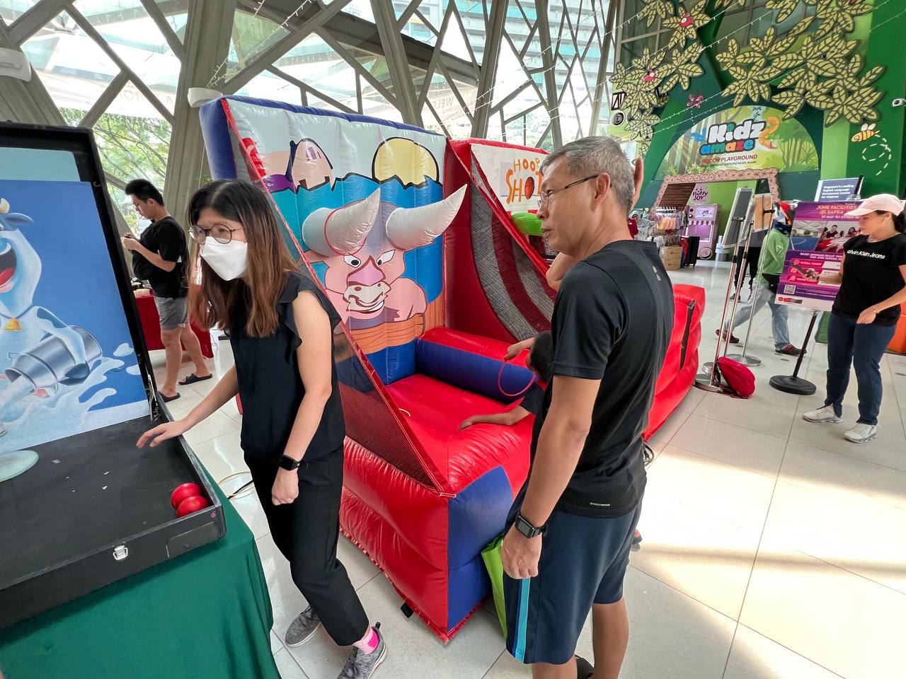 Inflatable Bull Ring Toss game at SAFRA, Singapore, where players aim to land rings on bull horns.