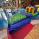 Close-up of the Connector platform floating on water, designed to connect two inflatable course elements.