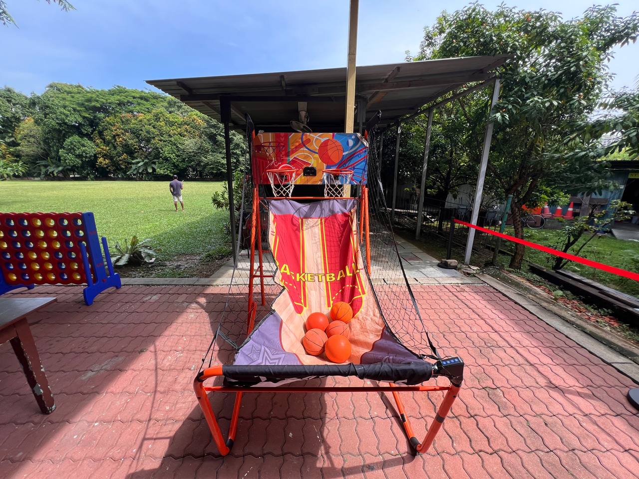 Two-player arcade basketball game with side-by-side hoops for friendly competition – located at Catholic Spiritual Center, Singapore.