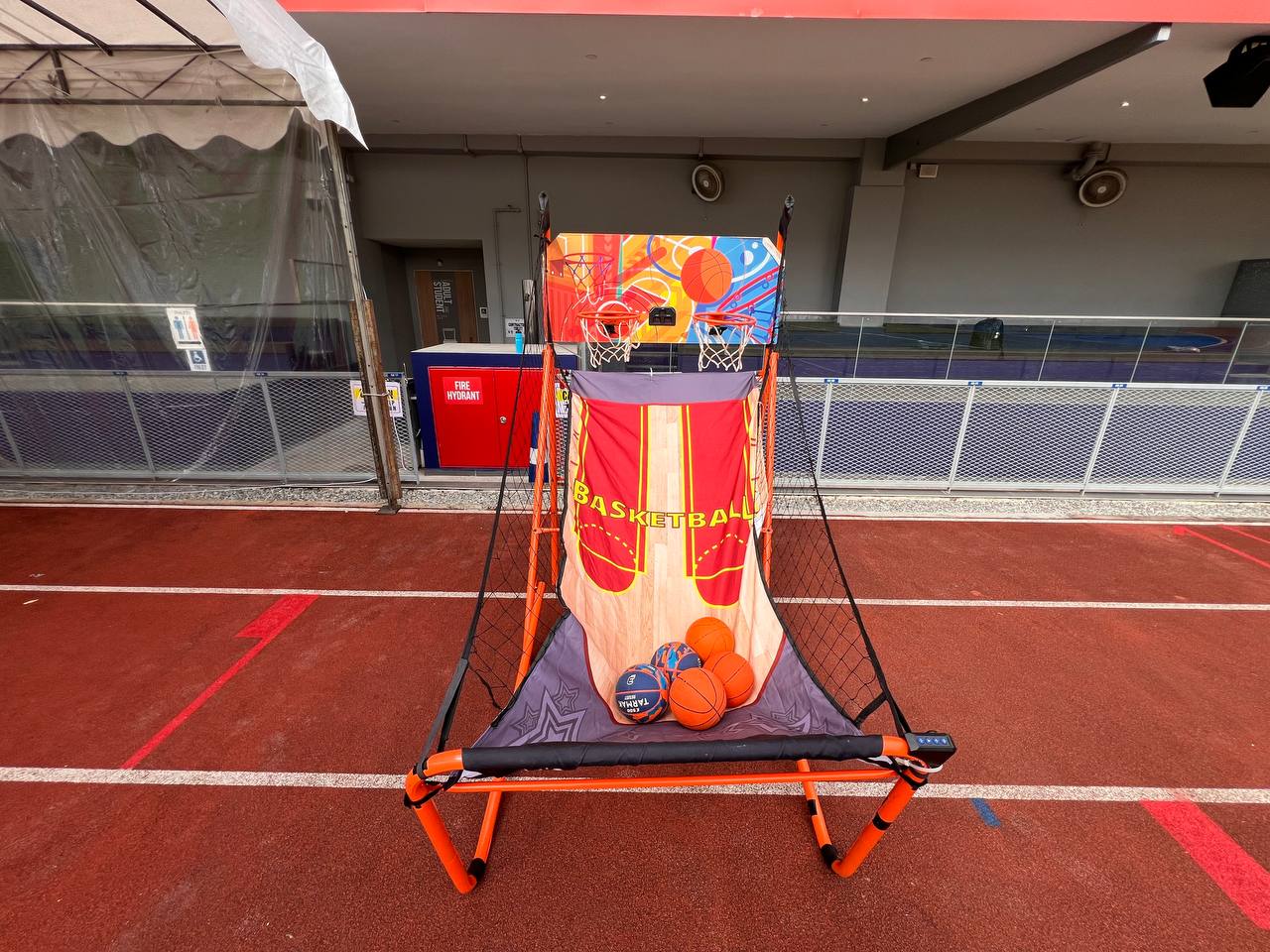 Test your shooting skills in this two-player basketball game at Singapore American School, available for rent