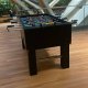 Tabletop soccer-style foosball game on display at National Gallery, Singapore, available for rental.