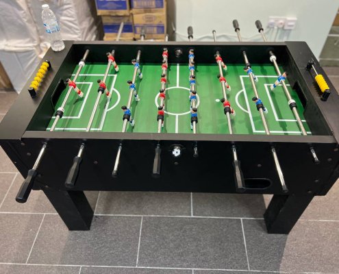 Tabletop soccer game setup at Tanjong Pagar CC Art Gallery, Singapore, designed for two-player competitive fun.