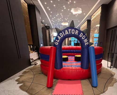 Gladiator Dome inflatable at Novotel Singapore, ready for players to stand on the platforms and play.