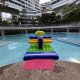 A close-up of the Drill inflatable showing two large holes and soft paddings, inviting players to crawl and duck through.
