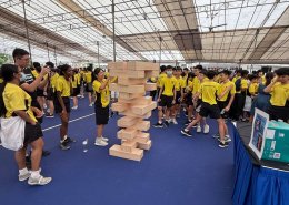 Large-scale Human Jenga game setup at Anderson Secondary School, Singapore, featuring students engaging in a fun team-building activity.