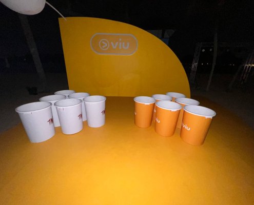Outdoor human size beer pong setup with customizable bucket colors at Siloso Beach, Singapore