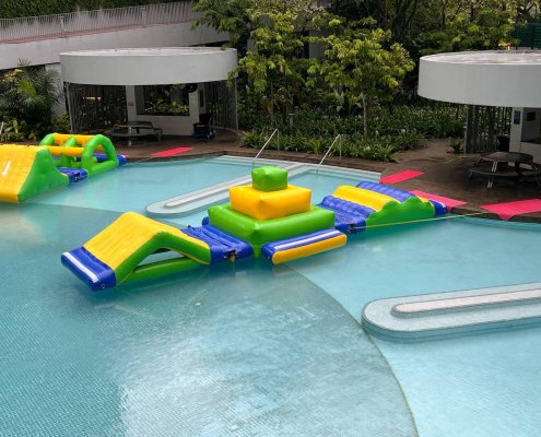 The Hump as part of a connected inflatable water course, offering a gentle bumpy path for kids and adults to cross.