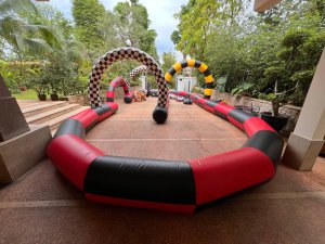 Inflatable race track at Queen Astrid Park, Singapore, with colorful lanes and soft barriers — great for fun racing games.