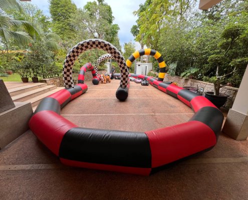 Inflatable race track at Queen Astrid Park, Singapore, with colorful lanes and soft barriers — great for fun racing games.