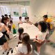 Students laughing and enjoying a regular air hockey game at Henry Park Primary School, Singapore.