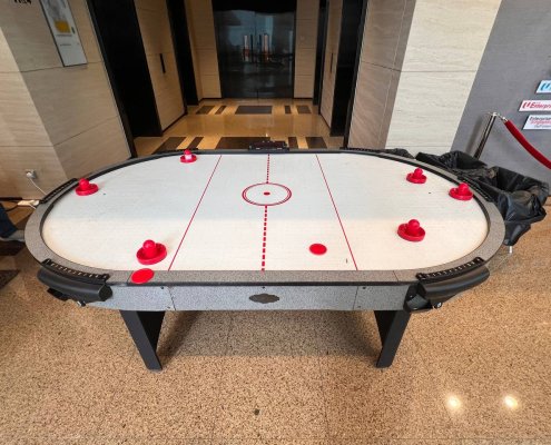 Close-up of a regular air hockey table, available to rent