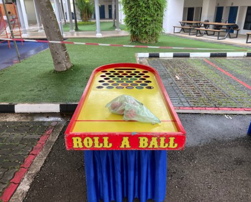 Roll a Ball game setup with a long track and scoring holes at the end, ready for play at Anderson Secondary School, Singapore.