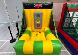 At Sengkan Grand Mall, Singapore, the Shuffle Balls game challenges players to aim and throw balls into the correct holes.