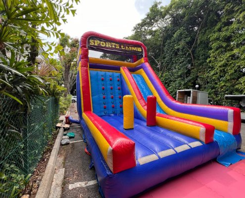 Colorful Sports Climb inflatable game at Allanbrooke Road, Singapore, featuring three inflatable pillars at the entrance and a central climbing wall