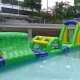 Inflatable water obstacle with a central rope suspended from a triangular green support, designed for swinging from one platform to another.