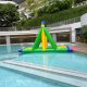 Close-up of the Swing obstacle’s green triangular pole with a rope for players to grip and swing across a water course.