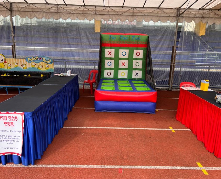 Inflatable Tic Tac Toe game in bright colors displayed at Singapore American School.