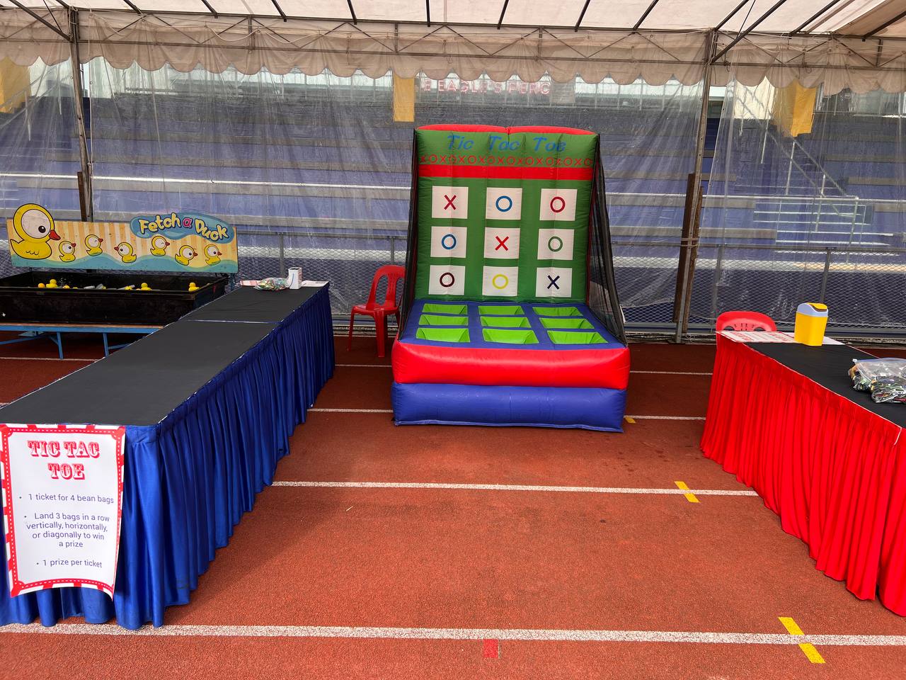 Inflatable Tic Tac Toe game in bright colors displayed at Singapore American School.