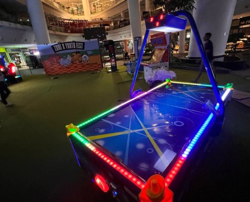 Air Hockey - The Star Vista LED Air Hockey table at The Star Vista, Singapore with vibrant lights and fast-paced gameplay for two players.