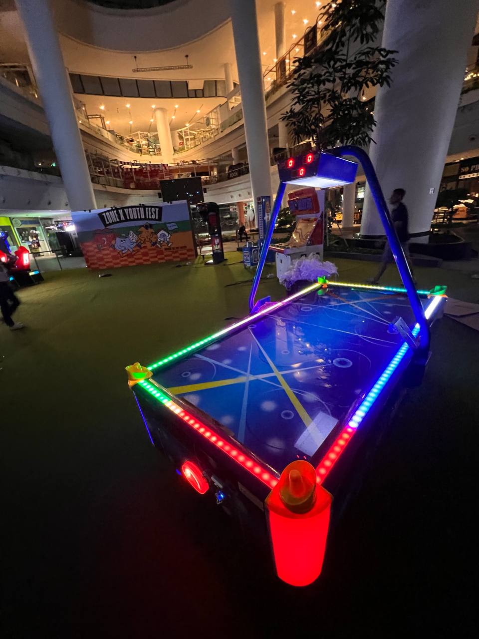 Air Hockey - The Star Vista LED Air Hockey table at The Star Vista, Singapore with vibrant lights and fast-paced gameplay for two players.