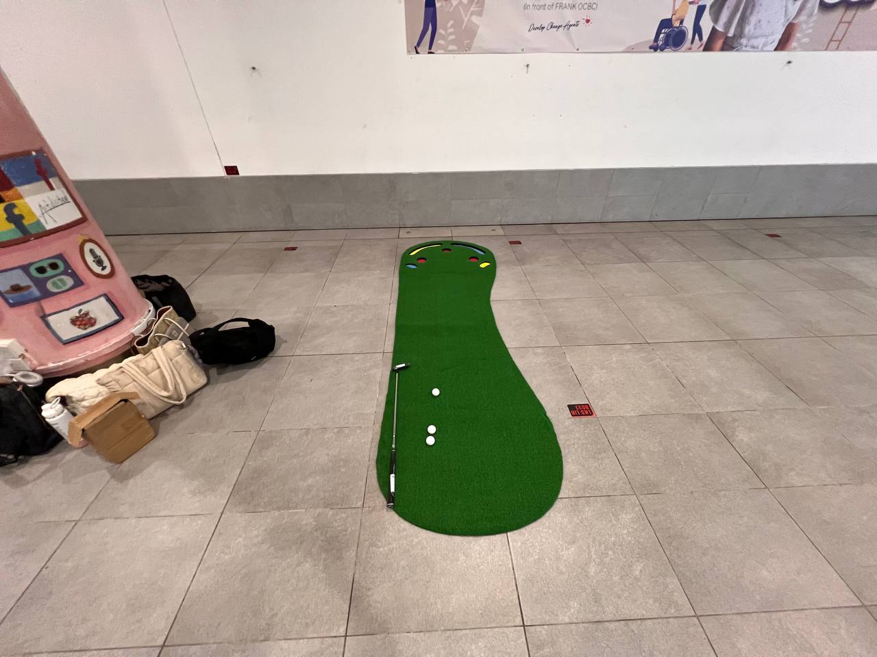 Big Foot Golf Putting Mats placed in an open space at Singapore Management University, Singapore, allowing guests to enjoy a fun and realistic golf practice activity.