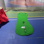 Big Foot Golf Putting Mat laid out on the ground at Woodlands Sports Pavilion, Singapore, offering a smooth, grass-like surface for putting practice.