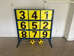 The Lucky 9 game displays a vibrant board with numbered targets arranged around the number 9, ready for play at Lakepoint Condo, Singapore.