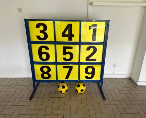 The Lucky 9 game displays a vibrant board with numbered targets arranged around the number 9, ready for play at Lakepoint Condo, Singapore.