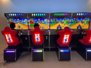 Guests playing Mario Kart arcade game at SIT Punggol Campus, Singapore – perfect for friendly racing battles