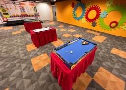 Mini 7 Ball Pool table with colorful balls and cue sticks, offering a compact and fun version of pool at New Tech Park, Singapore.