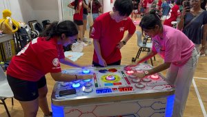 Fast-paced Naughty Beans game at National Junior College, Singapore — test your speed and reflexes in a fun head-to-head match.