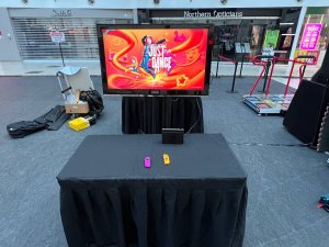 Nintendo Switch station setup with TV, ready for gaming at an event in Singapore.