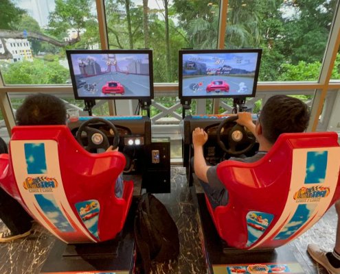 Outrun arcade racing machine at Fort Canning Hotel, Singapore – classic driving game experience for all ages