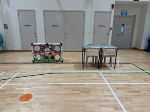 The Super Goal game station with a goalpost and a cover displaying five holes, encouraging players to score through the targets at Shuqun Primary School.