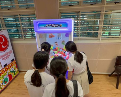 Toy Catcher claw machine game filled with plush toys at event in Bedok South Secondary School, Singapore