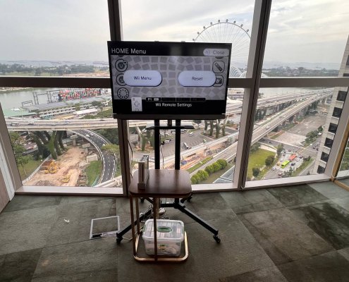 Wii gaming station setup at Centennial Tower, Singapore – interactive motion-based games for fun and active event entertainment